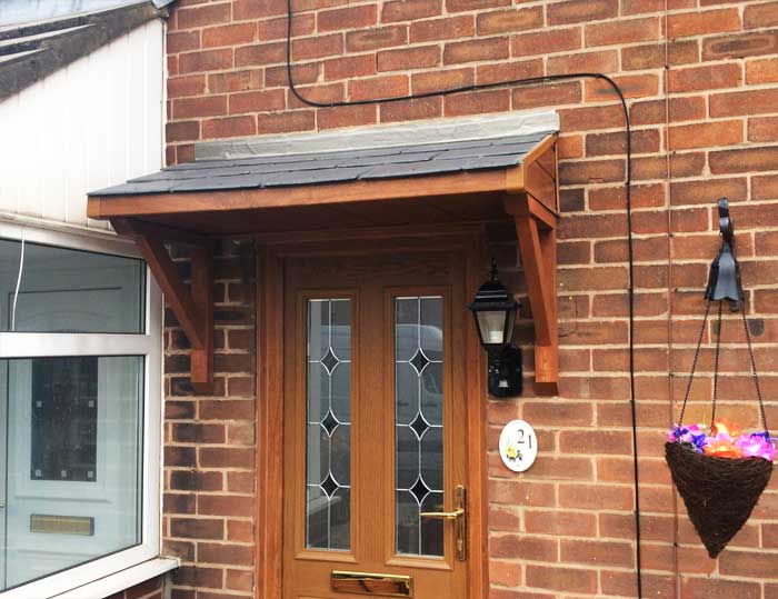Door canopy in simple lean-to style, with brown colour
